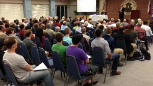 Congressman Bill Flores addresses town hall audience in Bryan.