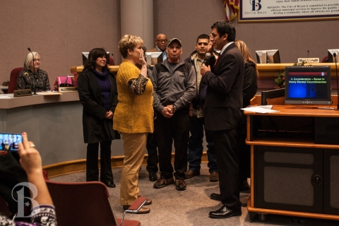 Photo courtesy the City of Bryan, councilman Rafael Pena sworn into office by City Secretary Mary Lynne Stratta.
