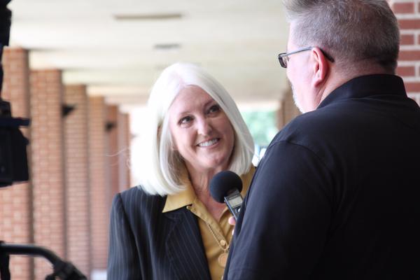 Photo from Blinn College Twitter feed of Dr. Mary Hensley and WTAW's Bill Oliver.