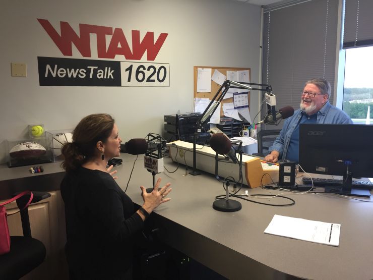 Brazos County A&M Club president-elect Lisa Burton visiting with WTAW's Bill Oliver April 11, 2016.