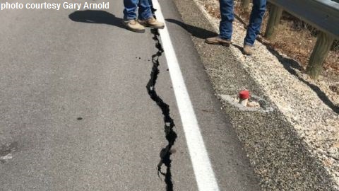 Photo courtesy of Brazos County road and bridge operations manager Gary Arnold, taken in September 2018, of the crack along I & GN Road. In the upper right hand corner of the photo there is a guardrail, which Arnold behind the guardrail the ground has dropped one and a half feet.