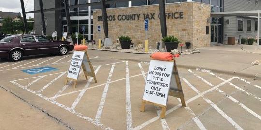 Signage outside the Brazos County tax office, May 22, 2020.