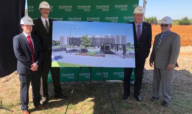 FUJIFILM Diosynth Biotechnologies officials around the architect's rendering at the groundbreaking of the Advanced Therapies Innovation Center on August 19, 2020. (L-R) : Michael Baker, Head of Process Development, Thomas Page, PhD, VP Engineering and Asset Development, Gerry Farrell, PhD, Chief Operating Officer, and Steven Pincus, PhD, Head of Science and Innovation.
