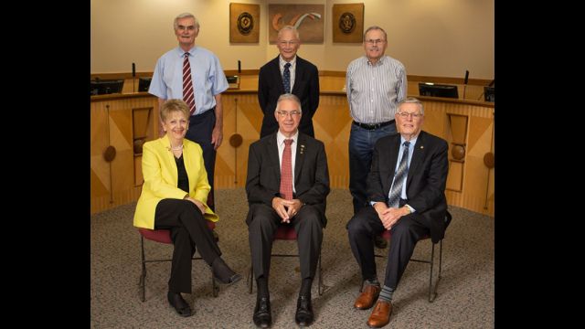 City of College Station photo of the current city council. Standing (L-R): John Crompton, Bob Brick, and Dennis Maloney. Sitting (L-R): Linda Harvell, Mayor Karl Mooney, and John Nichols.