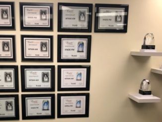 Display of National Association of Broadcasters Crystal Award finalist plaques and Crystal awards in the Bryan Broadcasting office lobby, March 11 2021.