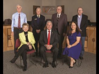 Photo from the city of College Station showing council members (Standing L-R) John Crompton, Bob Brick, John Nichols, Dennis Maloney and (Seated L-R) Linda Harvell, Mayor Karl Mooney, Elizabeth Cunha.