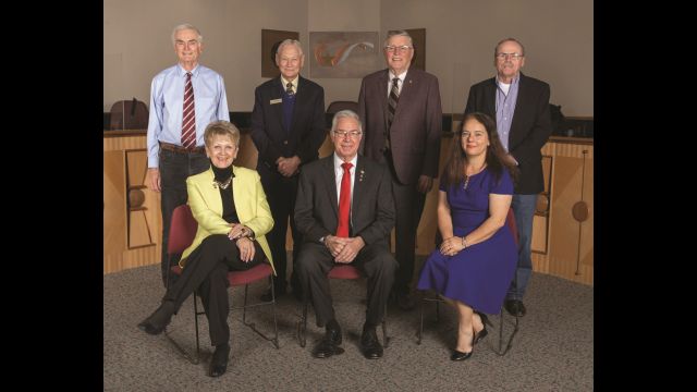 Photo from the city of College Station showing council members (Standing L-R) John Crompton, Bob Brick, John Nichols, Dennis Maloney and (Seated L-R) Linda Harvell, Mayor Karl Mooney, Elizabeth Cunha.