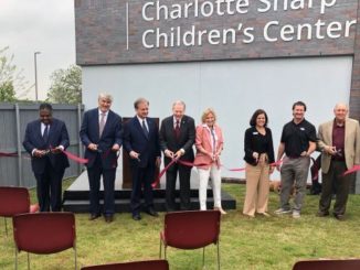 Ribbon cutting outside the Charlotte Sharp children's center, April 9 2021.