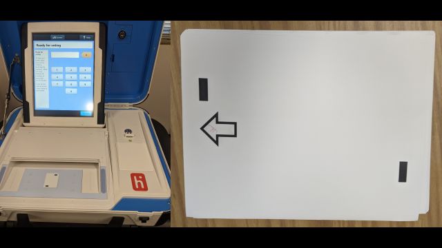 Modified Brazos County voting machine and a blank paper ballot.