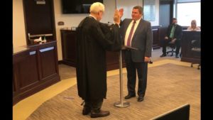 Texas 10th court of appeals justice Steve Smith (L) administers the oath of office to (R) new 361st district court judge David Hilburn.