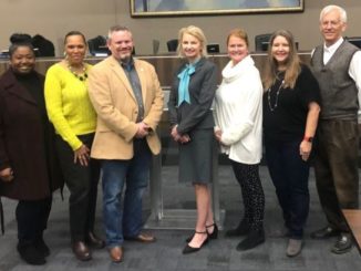 The lone finalist for Bryan ISD superintendent, Ginger Carrabine, in the middle of a group picture of Bryan ISD board members (L-R) Deidra Davis, Felicia Benford, Mark McCall, Carrabine, Ruthie Waller, Fran Duane, and David Stasny.