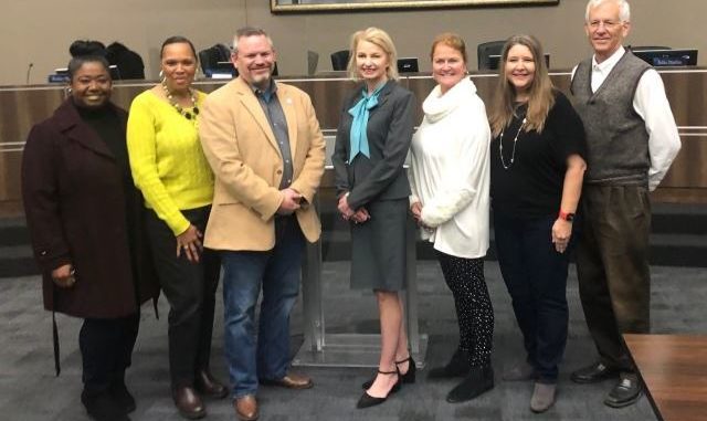 The lone finalist for Bryan ISD superintendent, Ginger Carrabine, in the middle of a group picture of Bryan ISD board members (L-R) Deidra Davis, Felicia Benford, Mark McCall, Carrabine, Ruthie Waller, Fran Duane, and David Stasny.