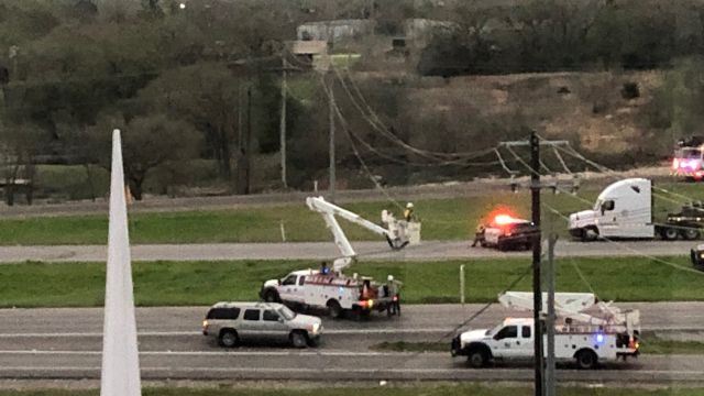 Looking out from Bryan Broadcasting offices to the freeway where College Station Utilities crews were repairing downed power lines, March 29 2022.