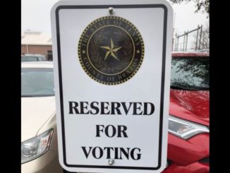 Parking sign in the lot west of the Brazos County elections office, June 1, 2022.