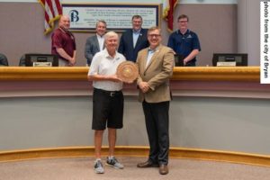 Photo from the city of Bryan of (front row L-R) Gary Blair and Andrew Nelson and behind them (L-R) Bryan council members Reuben Marin, James Edge, Brent Hairston, and Buppy Simank.