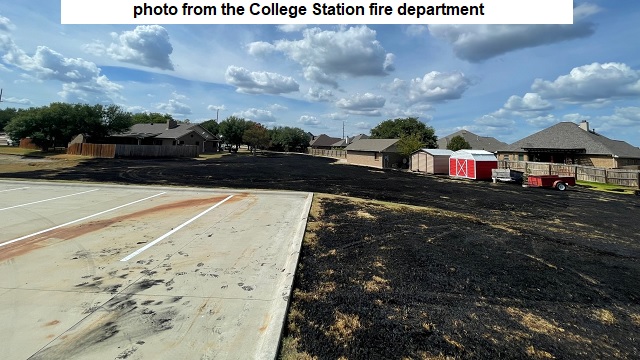 Photo from the College Station fire department of a grass fire August 16, 2022 near St. Thomas Aquinas church.