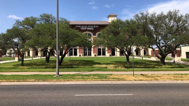 Behind the trees, College Station's new city hall building on July 31, 2022.