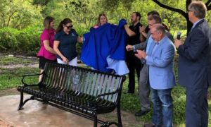 The unveiling of the Flynn Adcock memorial bench at Camelot Park in Bryan on September 2, 2022.