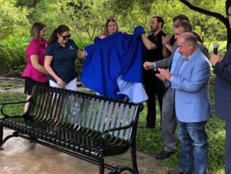 The unveiling of the Flynn Adcock memorial bench at Camelot Park in Bryan on September 2, 2022.