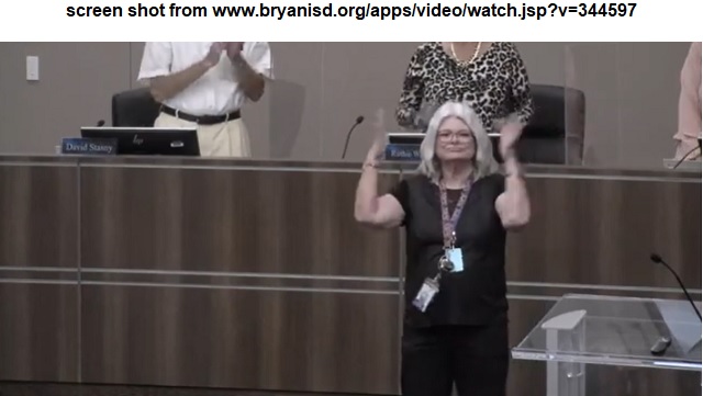 Screen shot from a Bryan ISD video at www.bryanisd.org/apps/video/watch.jsp?v=344597 of Kathy Sellers signing during the September 19, 2022 Bryan ISD school board meeting.
