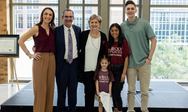 Photo of Dr. Anne Reber and her family at her retirement reception taken by Texas A&M photographer. At the far left is WTAW's Chelsea Reber, who is Anne's daughter.