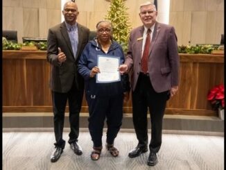 Photo from the city of College Station (L-R) Texas A&M assistant track coach Milton Mallard, Robin Beamon of USA Track & Field, and College Station mayor John Nichols.