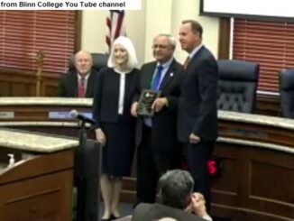Screen shot from Blinn College You Tube channel showing (L-R) chancellor Mary Hensley, Douglas Borchardt, and trustees chairman Jim Kolkhorst.