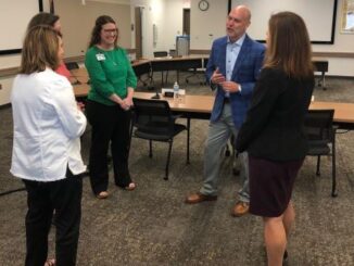 The lone finalist for College Station ISD superintendent, Dr. Tim Harkrider, visits with CSISD central office staff following the June 12, 2023 CSISD school board meeting.