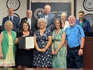 Brazos County photo from the county commission's July 25, 2023 meeting showing commissioners and representatives of Twin City Mission who accepted a proclamation recognizing the agency's 60th anniversary.