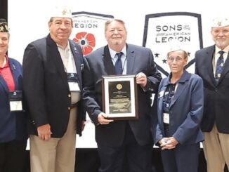 Joining Bryan Broadcasting News Director Bill Oliver (middle) at the Texas American Legion award presentation are members of Bryan Legion Earl Graham post 159. From (L-R) post commander Dale Hutchcraft, state vice-commander Tom Marty, state commander Gerry Hince, and state judge advocate J.D. Langley.