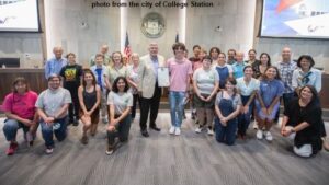 Photo from the city of College Station showing those accepting the "Light Out Nights" proclamation during the August 10, 2023 city council meeting.