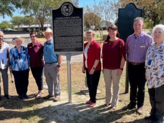 Members of the Brazos County Historical Commission gather next to a state historical marker that was unveiled at the 75th anniversary of the dedication of the College Station city cemetery on September 8, 2023.