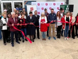 Participants at the ribbon cutting of the launch of the B/CS Salvation Army holiday campaign, November 10, 2023.