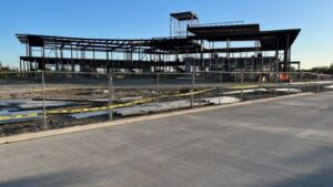 Photo taken April 3, 2024 of the Blinn College Bryan campus administration and student services building and in the foreground, the new Nash Street extension.