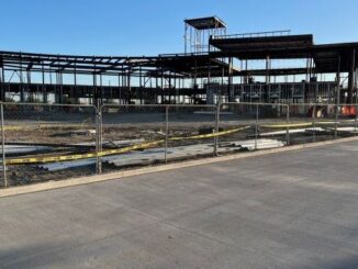 Photo taken April 3, 2024 of the Blinn College Bryan campus administration and student services building and in the foreground, the new Nash Street extension.