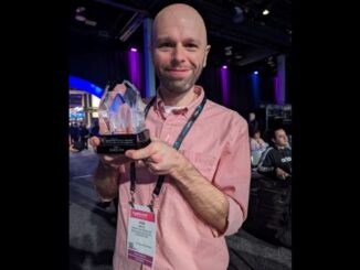 Bryan Broadcasting operations manager and Candy 95 afternoon host Rob Mack holding the National Association of Broadcasters Crystal Award at the NAB Radio Show in Las Vegas on April 16, 2024.