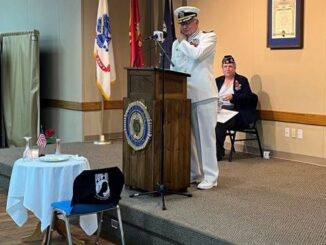 Photo taken May 27, 2024 at the Bryan/College Station Memorial Day program. At the podium is retired Navy captain LeeRoy Lance Jr. Seated is Bryan American Legion post commander Dale Hutchcraft.