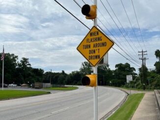 Photo taken May 17, 2024 of the city of Bryan's flashing "Turn Around Don't Drown Sign" on 29th Street near the Burton Creek bridge.
