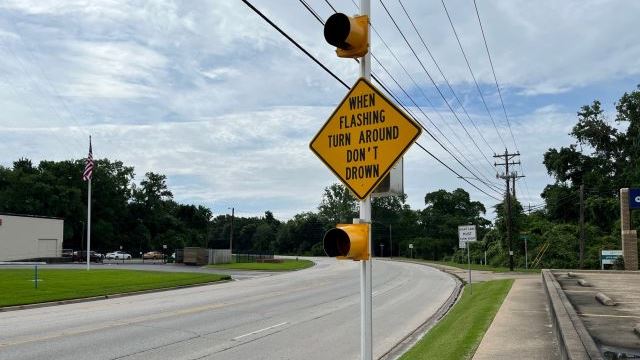 Photo taken May 17, 2024 of the city of Bryan's flashing "Turn Around Don't Drown Sign" on 29th Street near the Burton Creek bridge.