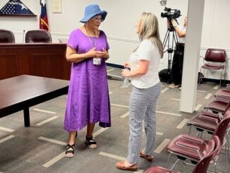 (L-R) Brazos County commissioner Wanda Watson and incoming interim tax assessor-collector Melissa Leonard visit following the July 12, 2024 county commission meeting.