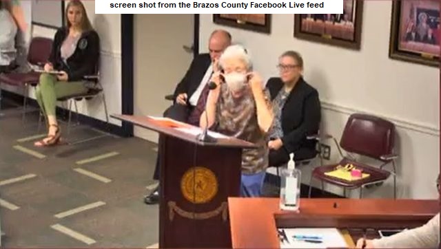 Screen shot of Mary Mize putting on a mask is from the Brazos County Facebook Live video stream.