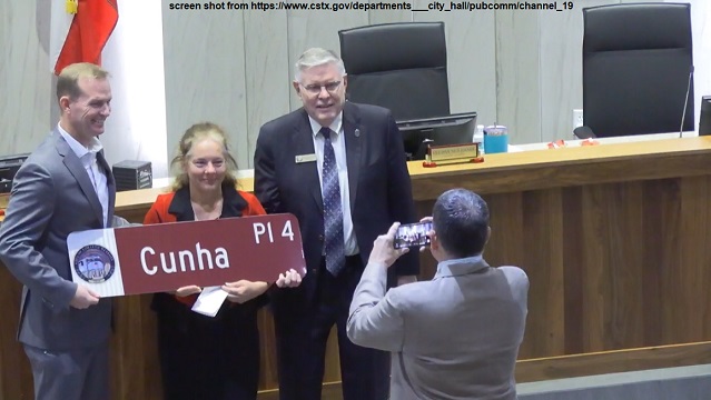 Screen shot of (L-R) College Station city manager Bryan Woods, retired councilwoman Elizabeth Cunha, and mayor John Nichols from https://www.cstx.gov/departments___city_hall/pubcomm/channel_19