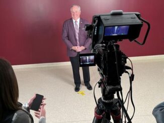 Texas A&M president Mark Welsh visiting with reporters on November 21, 2024.