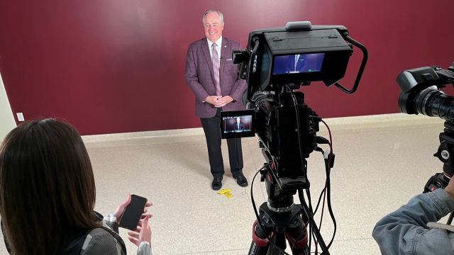 Texas A&M president Mark Welsh visiting with reporters on November 21, 2024.