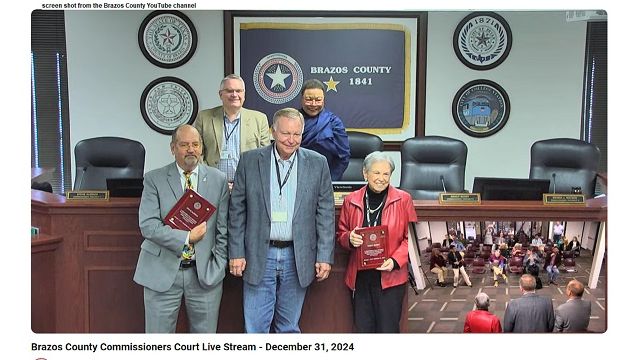 Screen shot from the Brazos County YouTube channel showing (front row L-R) Steve Aldrich, Duane Peters and Nancy Berry and (back row L-R) Chuck Konderla and Wanda Watson. Aldrich and Berry received plaques for their service during the December 31, 2024 county commission meeting.