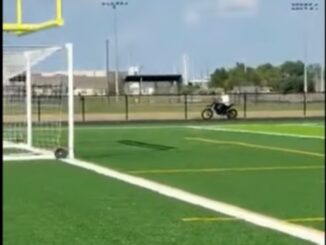 Screen shot from a College Station ISD video of a dirt bike on a new middle school track.
