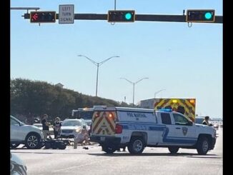 The scene after the collision of a SUV and a moped at Texas and Walton/New Main on October 1, 2025.