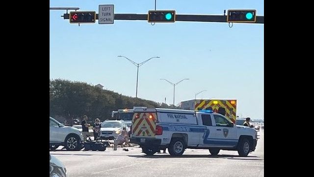 The scene after the collision of a SUV and a moped at Texas and Walton/New Main on October 1, 2025.